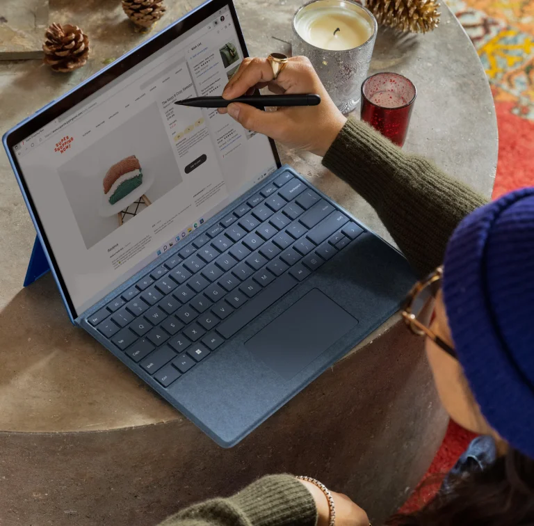 Team member working on a laptop